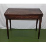 An Edwardian mahogany turn over tea table