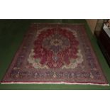 A large red ground carpet size 295cm x 400cm