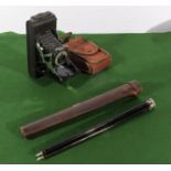 A Kershaw 8-20 series King Penguin folding camera together with a vintage tripod