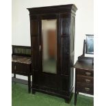 An Edwardian oak wardrobe.