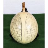 A Kalahari bushman ostrich egg water container