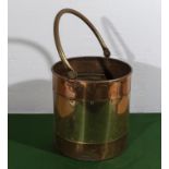 A copper and brass coal bucket