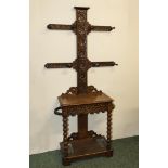 A carved oak hall stand