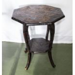 A carved occasional table