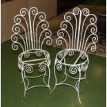 A pair of French style garden chairs