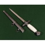 A reproduction German ceremonial dagger and scabbard