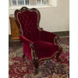 A Victorian button backed armchair