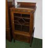 An Edwardian mahogany music cabinet