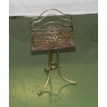 An Edwardian brass paper rack