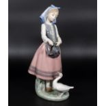 A Lladro figure goose girl