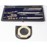 An architects instrument set and a travel magnifying glass