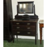 An Edwardian oak dressing table.