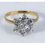 An 18ct gold seven stone diamond cluster ring 1.25 carat, size P