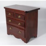 A miniature Victorian chest repolished.