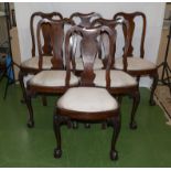 A set of six mahogany dining chairs with ball and claw feet, cabriole legs with carved knees and