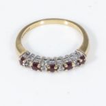 An 18ct gold ring set with five rubies and diamonds, size K