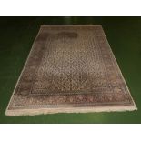 A pink and beige ground rug 190cm x 305cm