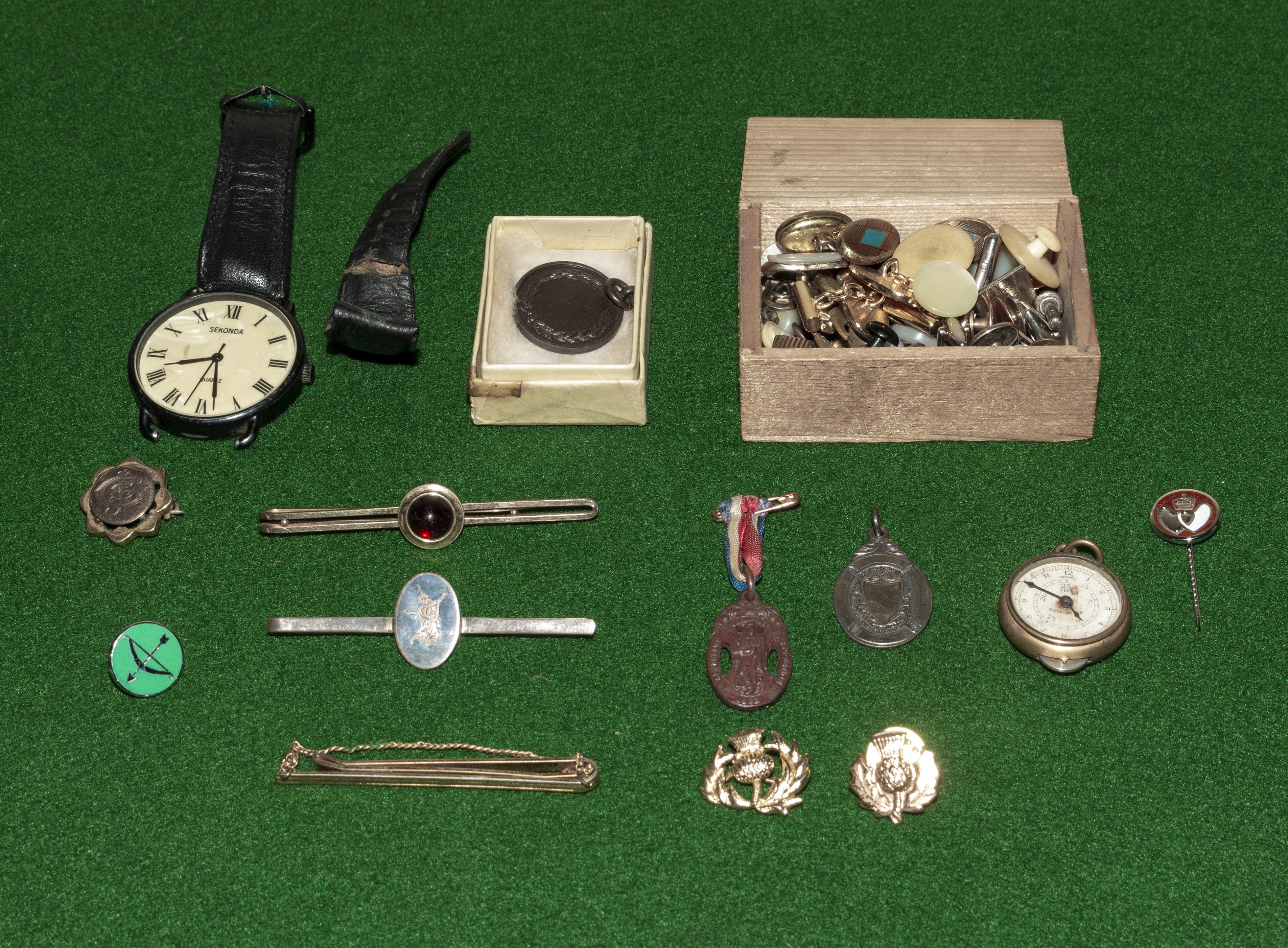 A collection of collar studs, tie pins and other items