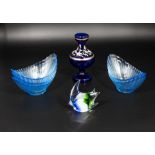 Five blue glass melon dishes, a fish and vase