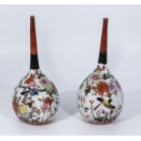 A pair of Japanese bottle vases decorated with birds and flowers