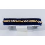 A 9ct gold and diamond bracelet