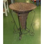 A wrought iron stand and basket