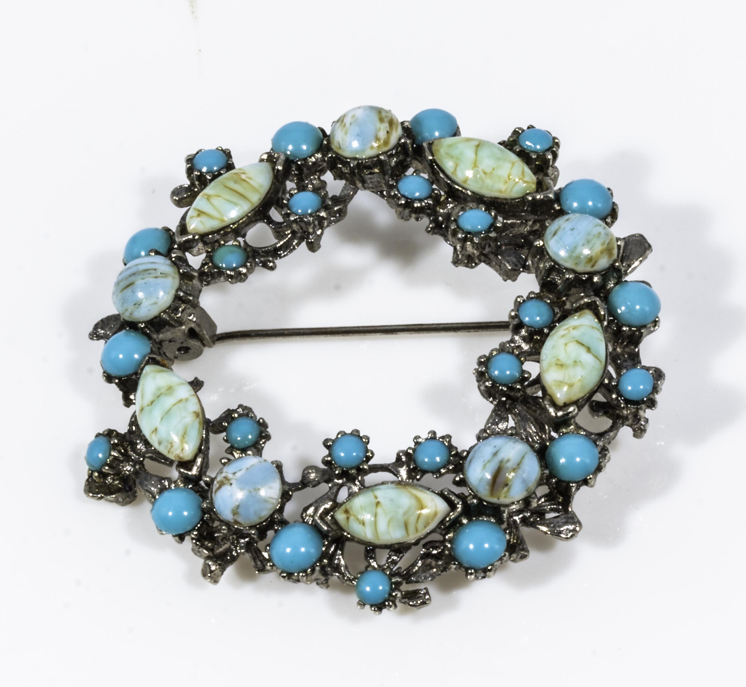 A brooch set with turquoise