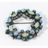 A brooch set with turquoise