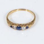 An 18ct gold ring set with three sapphires and two diamonds, size N