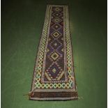 A Sunni Kilim wool runner 320cm x 62cm