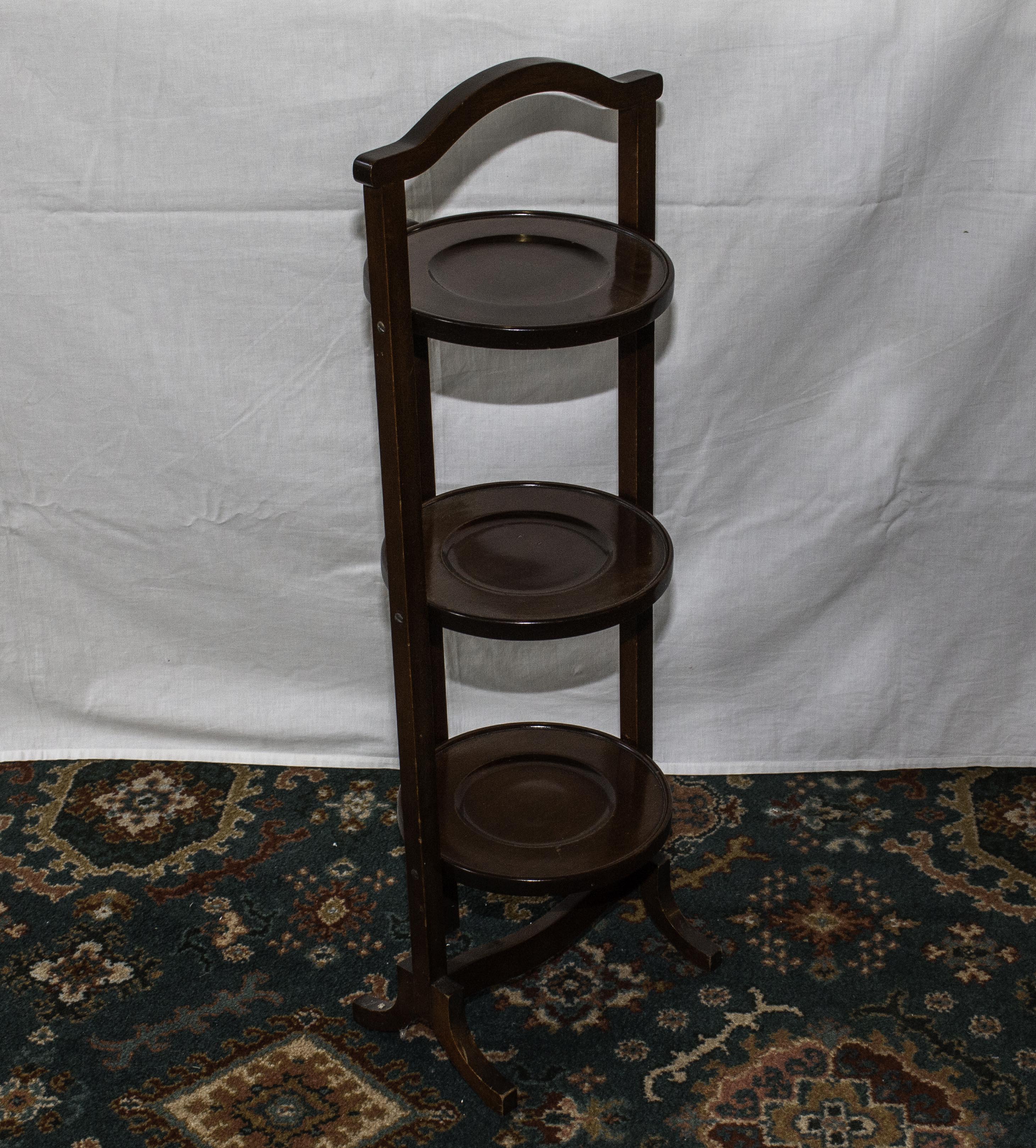 A three tier folding cake stand