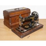Vintage Veritas hand crank sewing machine with hood