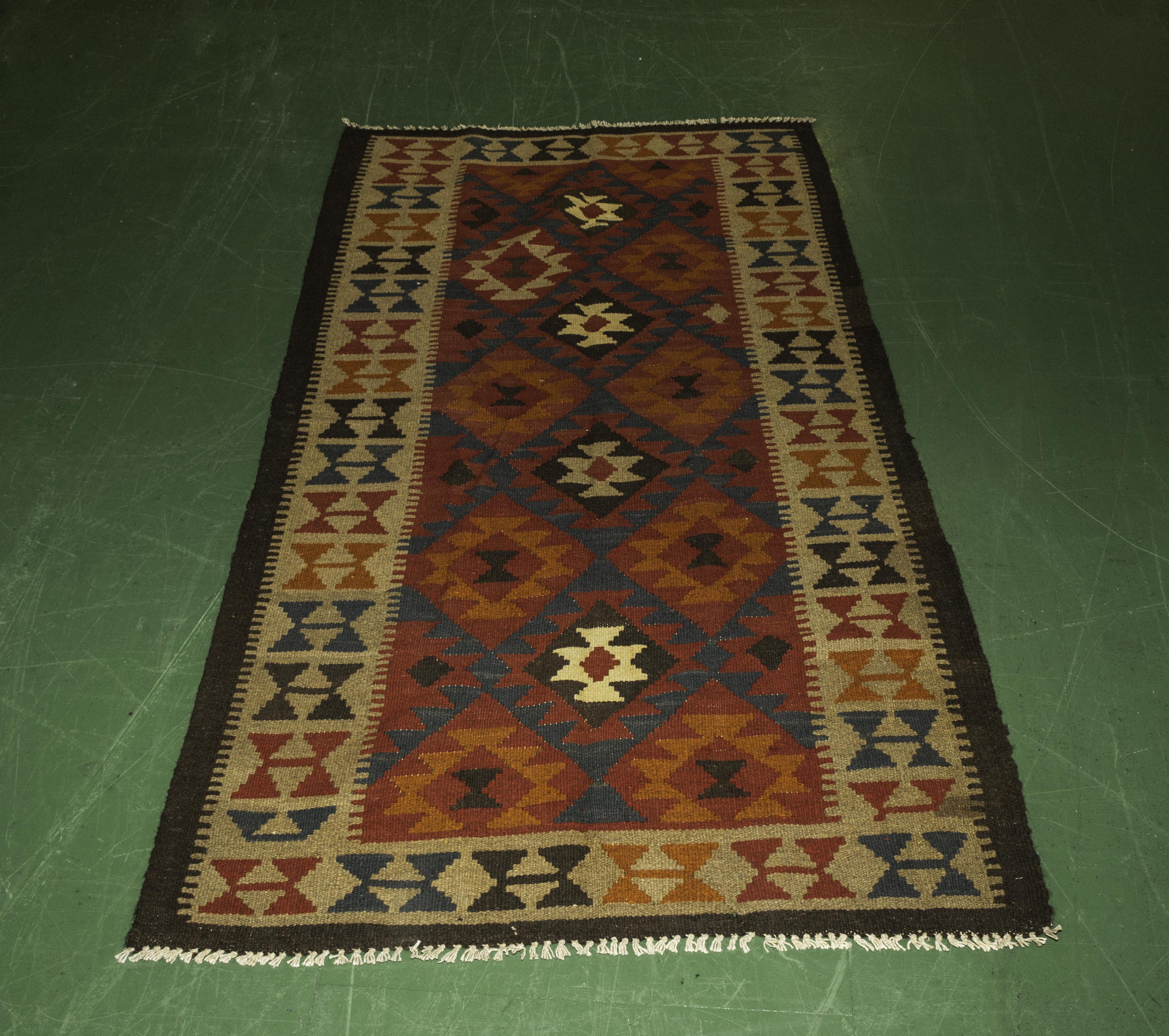 A Chobi vegetable dyed rug 107 cm x 191 cm