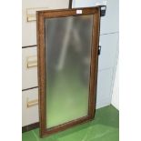 An oak framed mirror