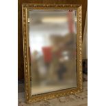 A gilt framed wall mirror