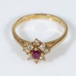 An 18ct gold ruby and diamond cluster ring, size K