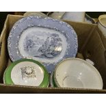 A box containing serving plates and tureens