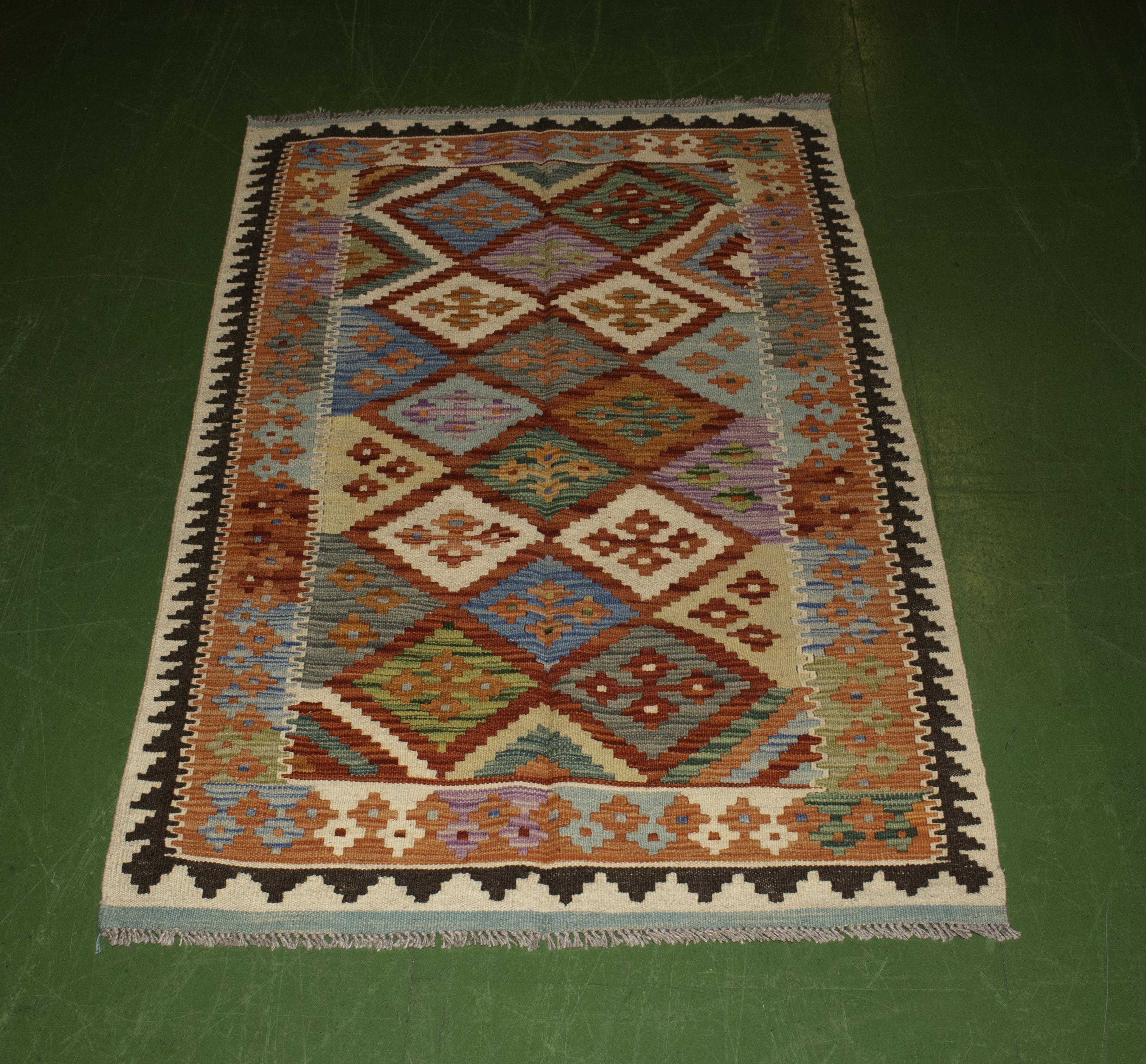 A Chobi vegetable dyed rug 152 cm x 96 cm