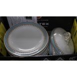 A box containing plates and serving dishes