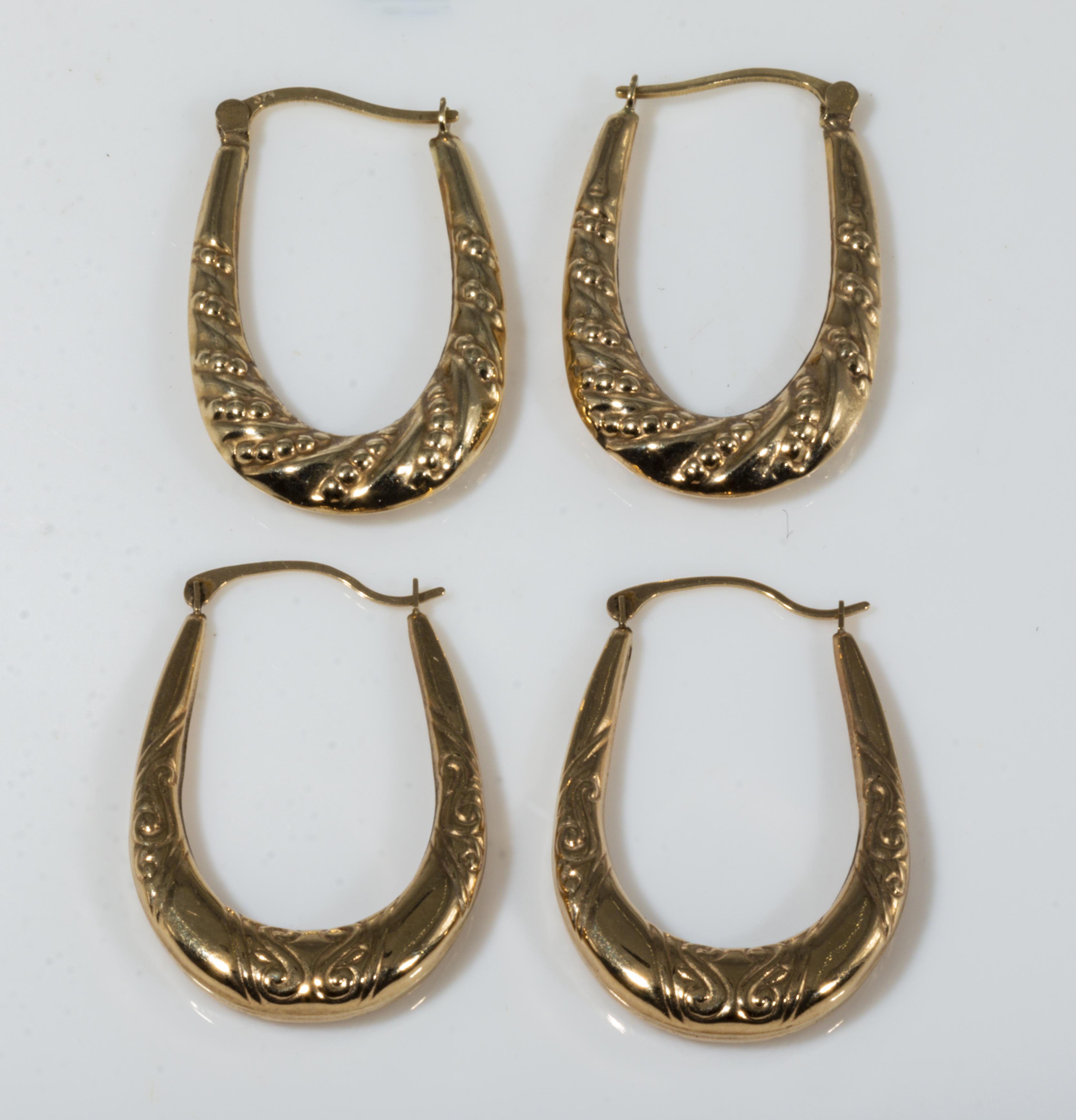 Two pairs of 9ct gold horseshoe shaped earrings