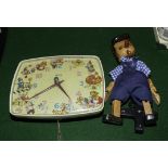 A child's Smiths wall clock and a wooden Pinocchio puppet