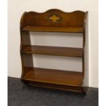 A mahogany wall shelf