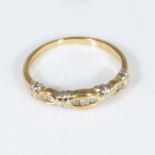 An 18ct gold ring set with diamonds, size K
