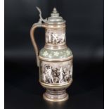 Porcelain pewter lidded jug painted with classical women with animals in sepia hues, mark to base