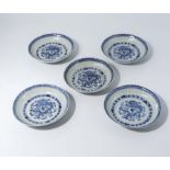 Ste of 5 Chinese blue and white bowls painted with a dragon to the centre, character marks to verso.