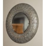 A pierced metal wall mirror