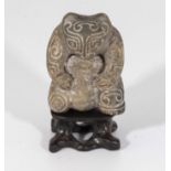 A Shang dynasty style mythical beast hardstone jade with stand