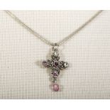A silver cross set with rose quartz and chain
