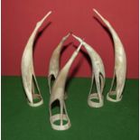 Five carved horns modelled as birds