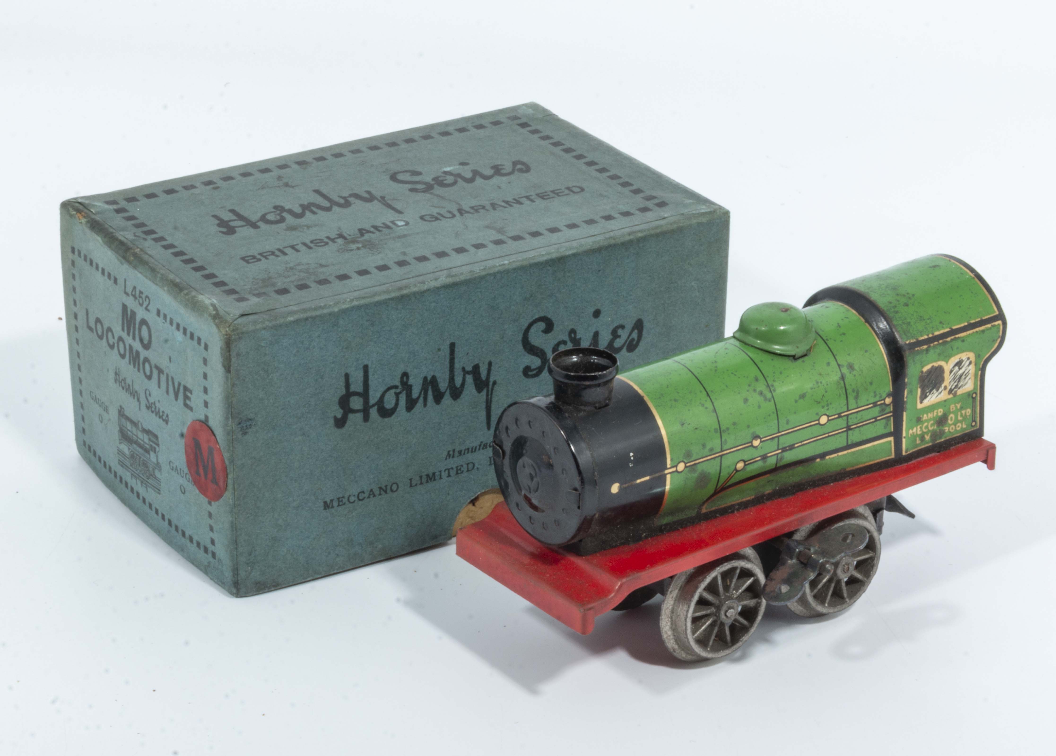 A clock work Hornby clockwork train in box. Working